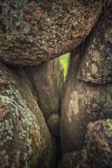 small hole between huge granite boulders in canyon
