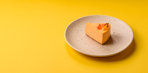 A slice of yellow cheesecake cake flavored with lemon and passion fruit