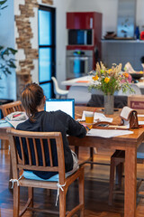 Student Working at Home Desk in Cozy Interior