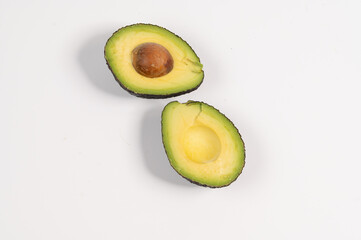 Close up of fresh avocado cut in half, Avocado sliced ​​isolated on white background.