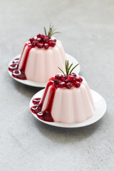 Vegan Pomegranate Cream pudding, Panna Cotta. With sauce. On a plate