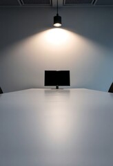 white table with a monitor on top of it