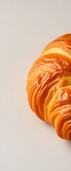 orange croissant sitting on top of a white table