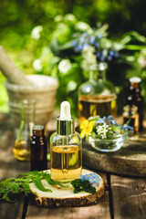 Alternative green herbal medicine. Natural plant-based ingredients for skin care beauty products, perfumery production. Small business, laboratory, drug research, organic extracts in glassware
