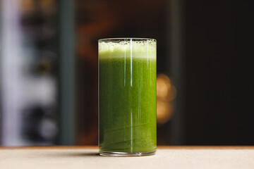 A refreshing glass of vibrant green smoothie
