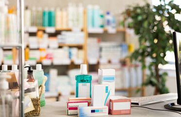 Medicines and hygiene products displayed on counter in pharmacy