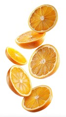 Obraz premium Arrangement of several cut oranges in the air on a white background