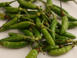 Bird's eye chilies or cayenne pepper on white background