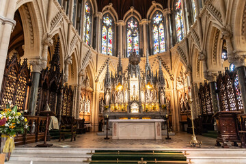 This striking photograph captures the grandeur of St. Colman's Cathedral in Cobh, Ireland—a stunning example of Gothic Revival architecture and a prominent landmark overlooking Cork Harbo