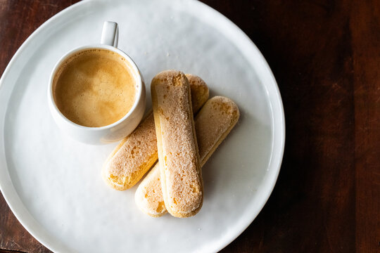 Cup of espresso with lady finger cookies	