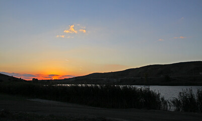 Watching the sunset on the lake with a sense of union