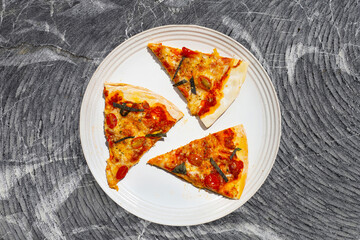 Slices of pizza on white background.