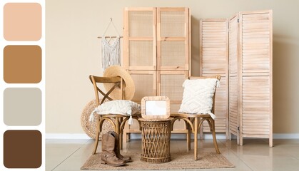 Light of stylish room with wooden chairs and folding screen with wicker table and boots. Different color patterns