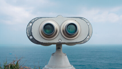 coin operated binoculars on the beach