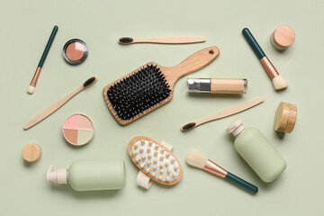 Composition with different bath supplies and cosmetic products on green background