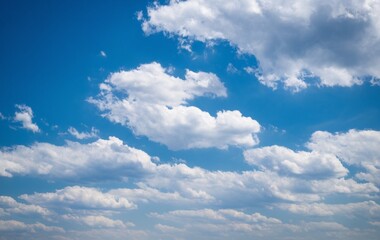 Obraz premium A clear blue sky with fluffy white clouds