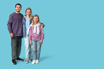 Fototapeta premium Happy family in stylish denim clothes on blue background
