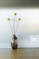 A bright kitchen set with a stylish bouquet in a stylish living room