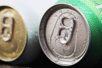 Cold canned beer ready to drink in the fridge