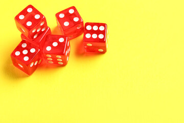 Red dices on yellow background