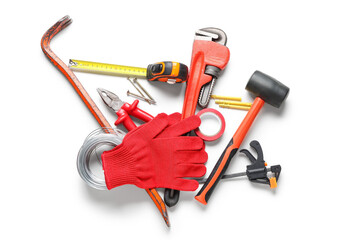 Gloves and construction tools on white background