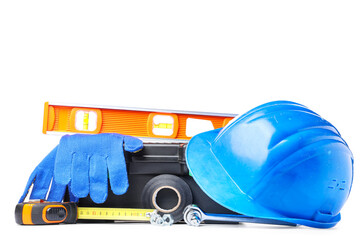 Naklejka premium Hardhat, gloves and box with construction tools on white background
