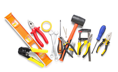 Different construction tools on white background