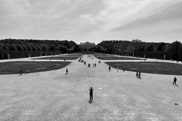 Distant person taking pictures of the gardens 