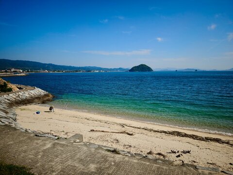 Capturing the serene beauty of the Seto Inland Sea, this collection showcases picturesque beaches, clear turquoise waters, and lush green hills surrounding Fuwari Peninsula in Ehime Prefecture, Japan.