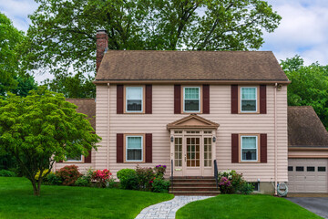 Traditional colonial-style family home with French door entry in Newton, Massachusetts, USA