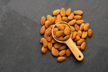 Dried almond nuts in a spoon - Prunus dulcis