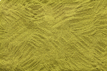 Moringa oleifera - Organic moringa powder scattered in the background