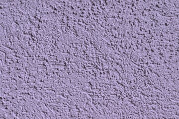 A textured and purple wall. Purple and gray background for template or blank. Construction material.