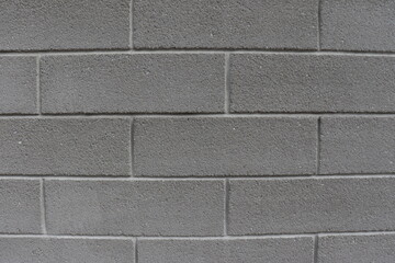 Gray brick wall and construction industry. Material for outdoor wall. Template or blank in dark gray and for presentation.