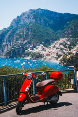 red vespa scooter overlooking positano on the amalfi coast in summer.. © Angel
