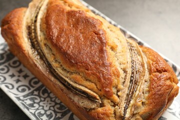 Delicious banana bread on grey table, closeup