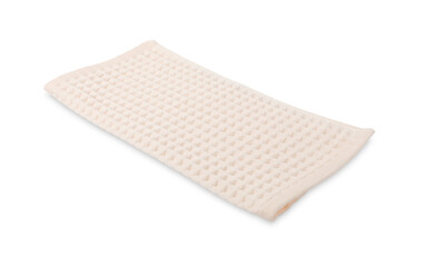 Clean beige waffle towel isolated on white