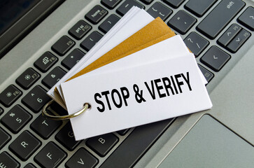 STOP AND VERIFY note on keyboard encouraging users to think before they act online