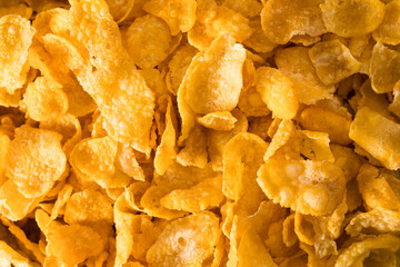 Full frame photo of crunchy golden cornflakes for breakfast