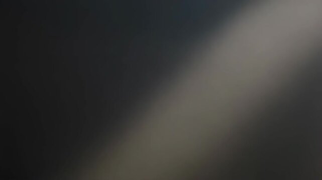 Abstract gray gradient background with striped pattern texture moving slowly and smoothly