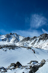 A group of mountaineers at the ascent to the peak of Munku Sardyk, West Sayan, Russia