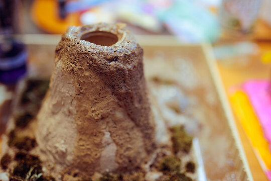 Baking Soda Volcano Experiment Displayed at a Science Fair. Funny science experiment done in school to prove chemical reaction 