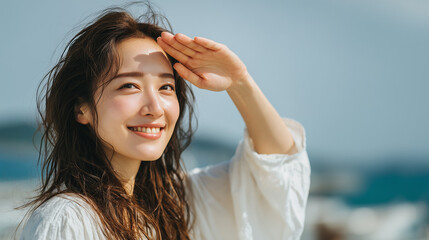 ナチュラルメイクの笑顔のロングヘアの日本人の女性の夏のイメージ