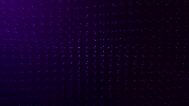 Purple lights on a dark background perfect for use in night club promotions, music album covers, or fantasy themed designs. Vibrant and mysterious atmosphere.
