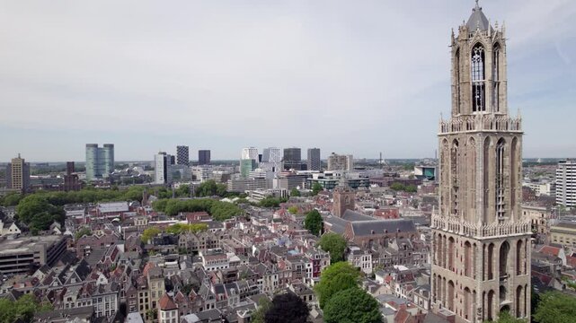 Aerial reveal of church and gothic architecture of the Utrecht diocese ambulatory and transept. Holland religious tourist destination seen from above.