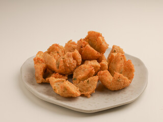 Fried meatball on the plate, isolated on white