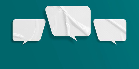 White speech bubble crumpled paper isolated on green background