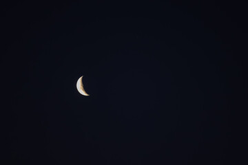 Crescent moon in the night sky with copy space