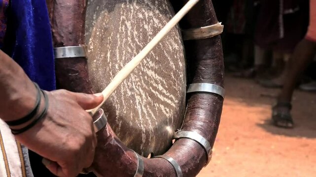 Closeup of an artist playing Thavil, a South Indian percussion musical instrument