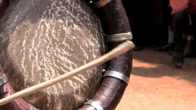 Closeup of an artist playing Thavil, a South Indian percussion musical instrument